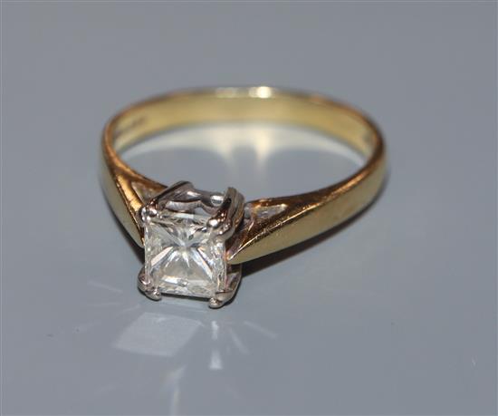A princess-cut solitaire diamond ring, 18ct gold shank, size K.